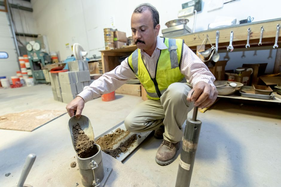 A laboratory technician performing construction materials testing
