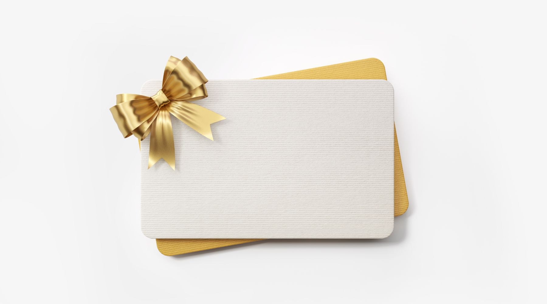 White gift card adorned with a golden bow on a plain background.