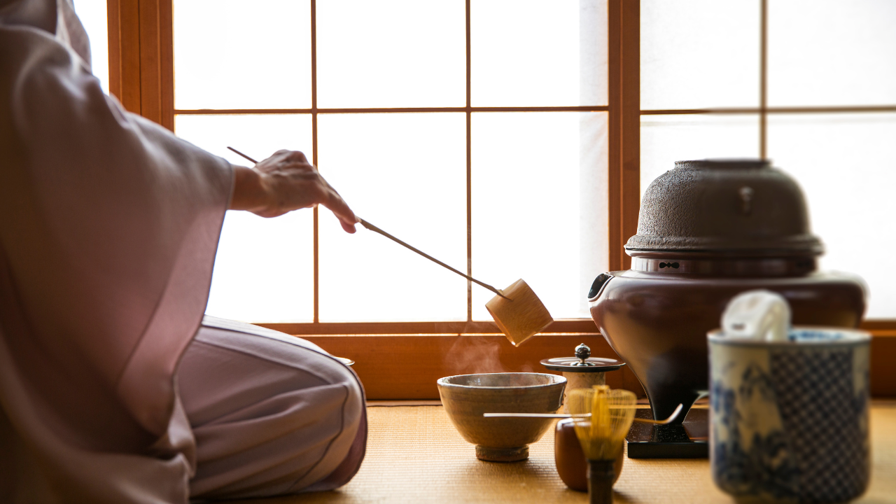 Japanese tea practitioners utilise traditional methods to prepare for a tea ceremony.