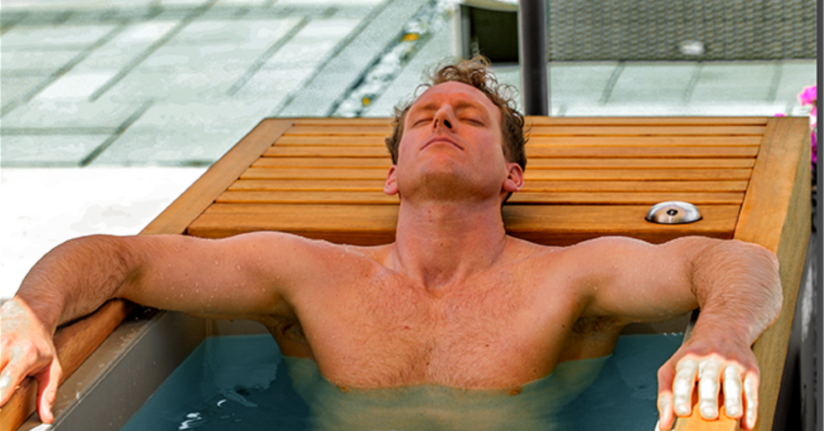 An athlete taking an ice bath for cold water therapy in the Medical Frozen 1™ cold plunge.