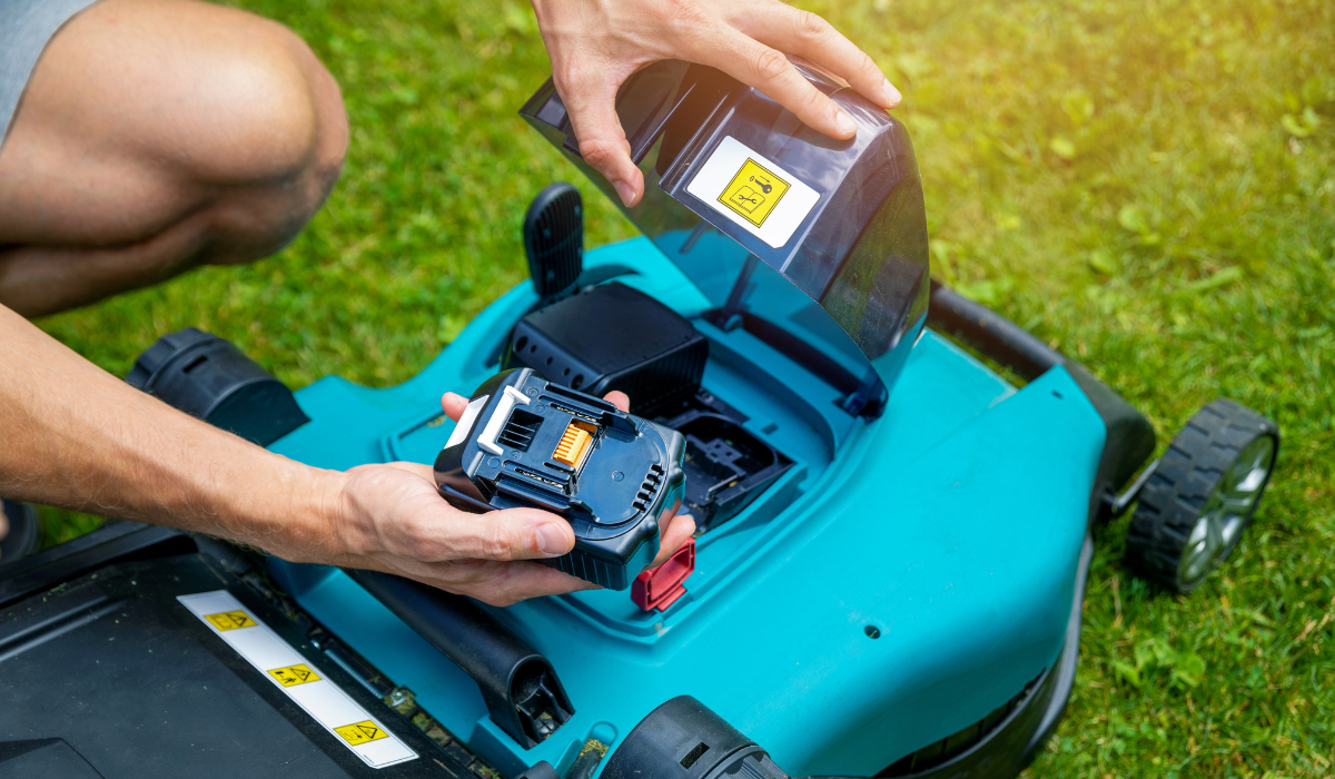 Figure removing an electric lawn mower's battery