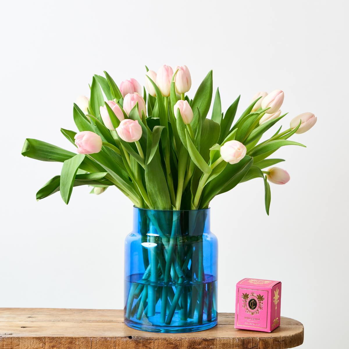 tulip flower arrangement with pink cape island candle