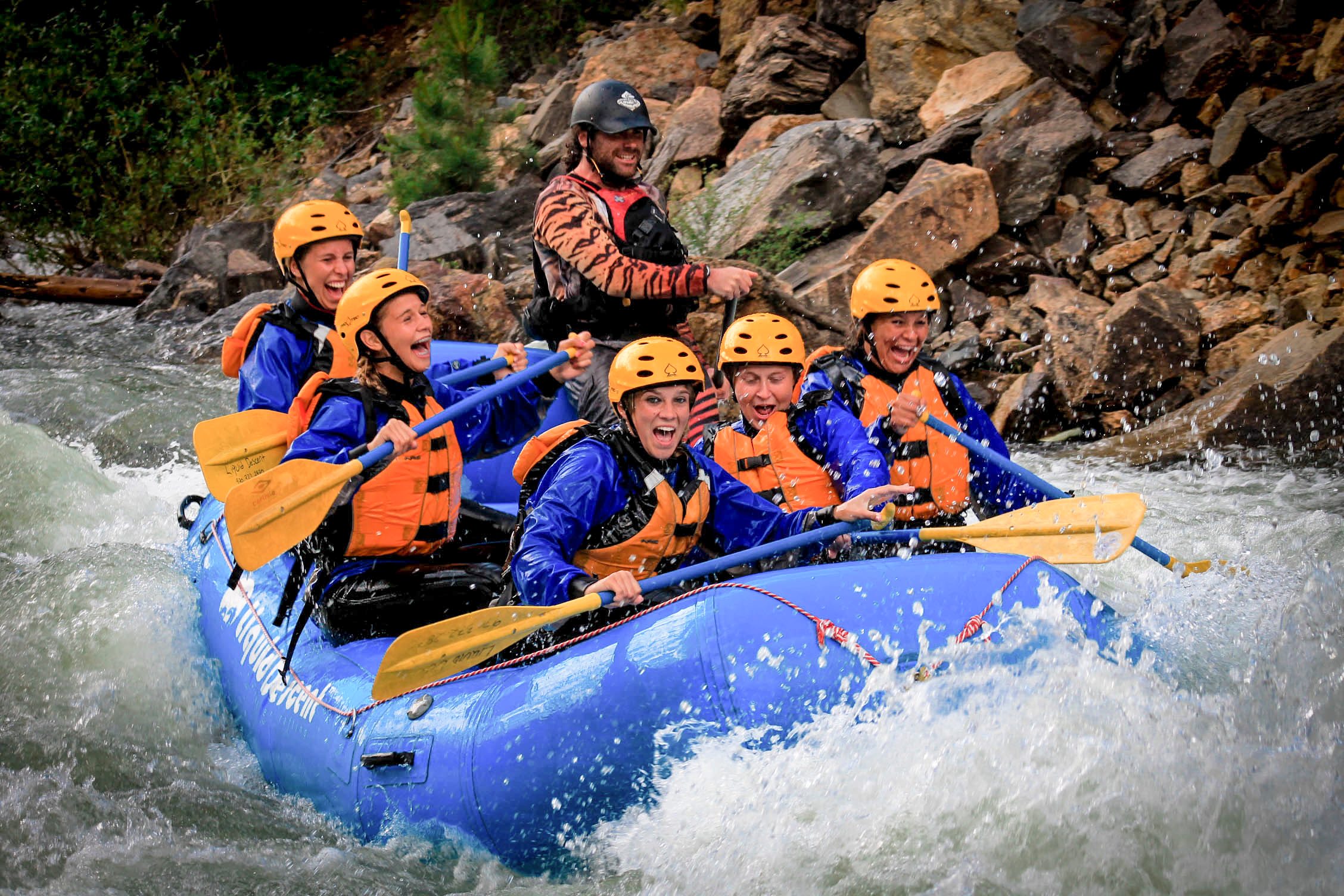 A corporate team on a whitewater rafting tour 