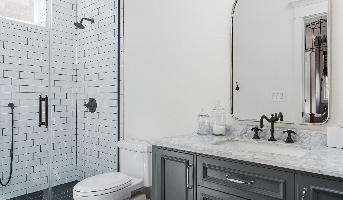 All white bathroom space- slate grey cabinetry - modern/Victorian style