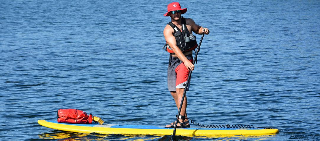 man on a solid paddle board