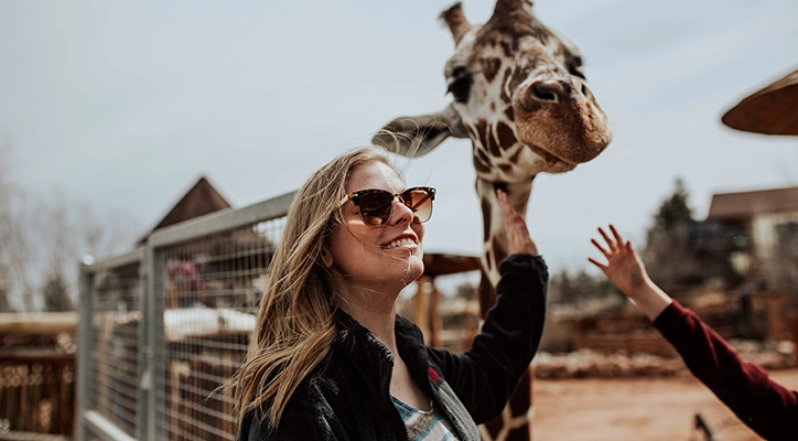 A lady enjoying the San Diego Zoo.