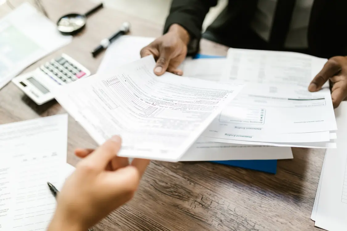 Business broker showing client a clear breakdown of commission and fees