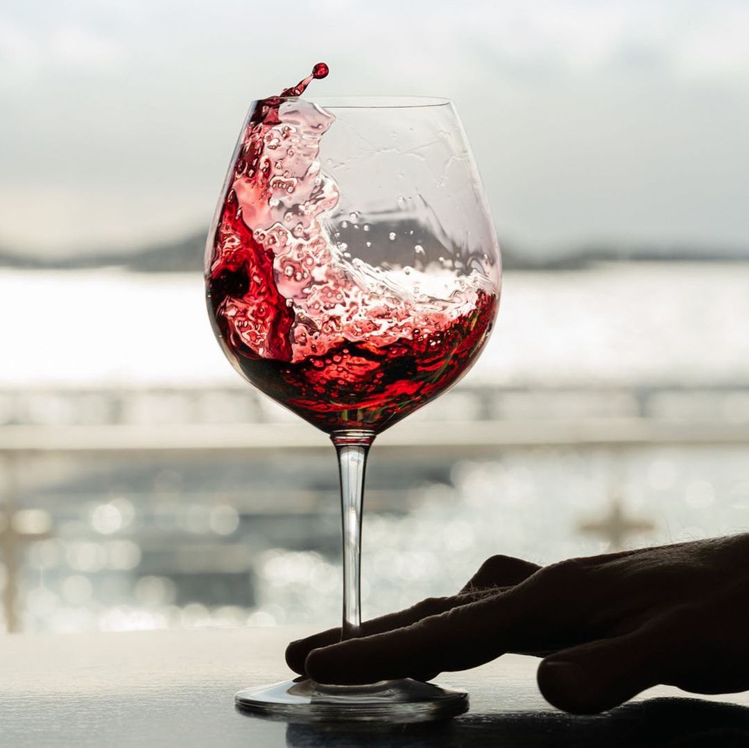 Red wine swirling in a wine glass