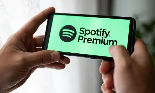 A person using Spotify Premium on their phone