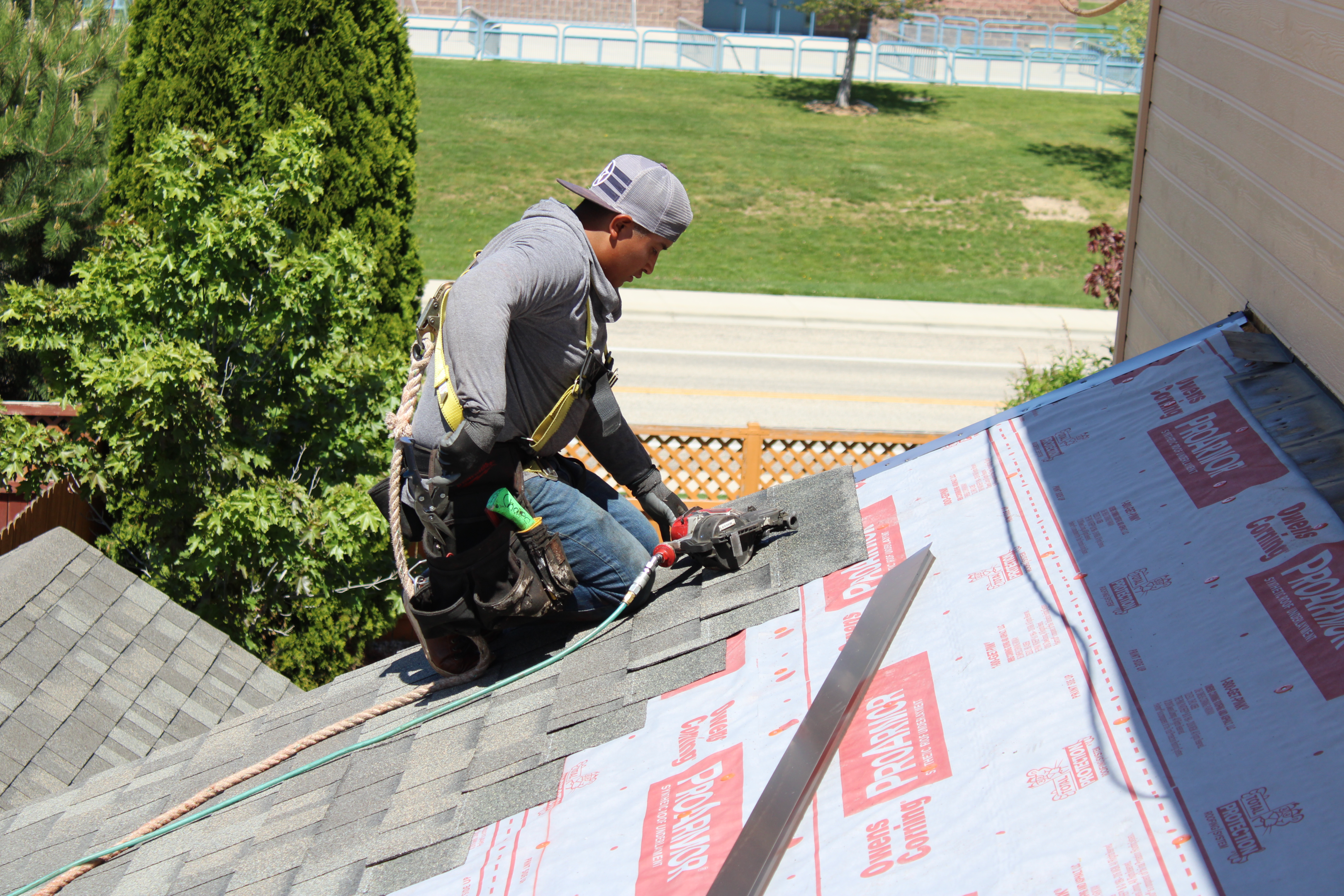 Installation of shingles on the Roof's Edges (Rakes) over the metal flashing. 