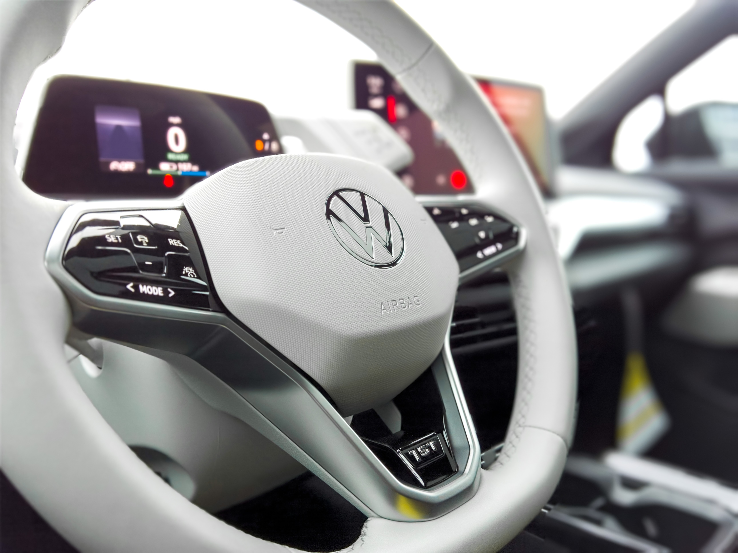 White steering wheel with Volkswagen logo