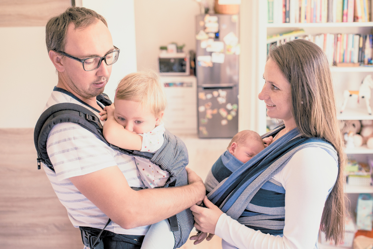 parents wearing baby and toddler