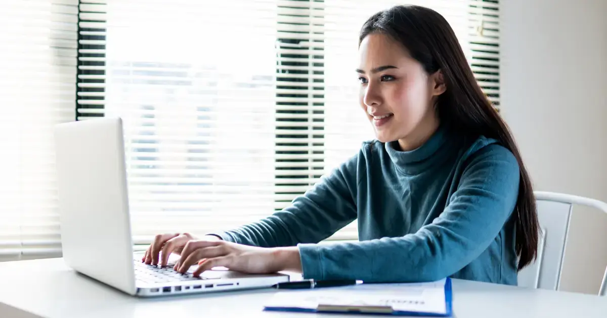 Woman preparing to file Form 7004 for tax extension, following the instructions for form 7004.