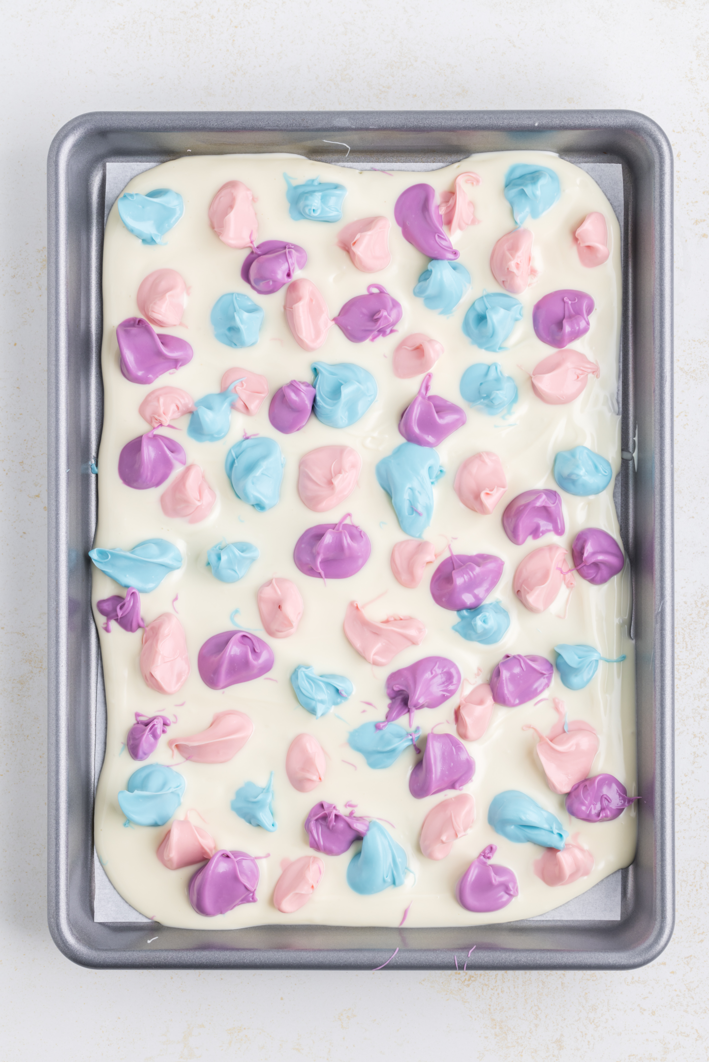 dollops of candy melts on top of white chocolate