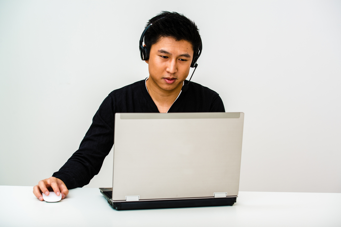 Filipino candidate looking focused during a remote interview session
