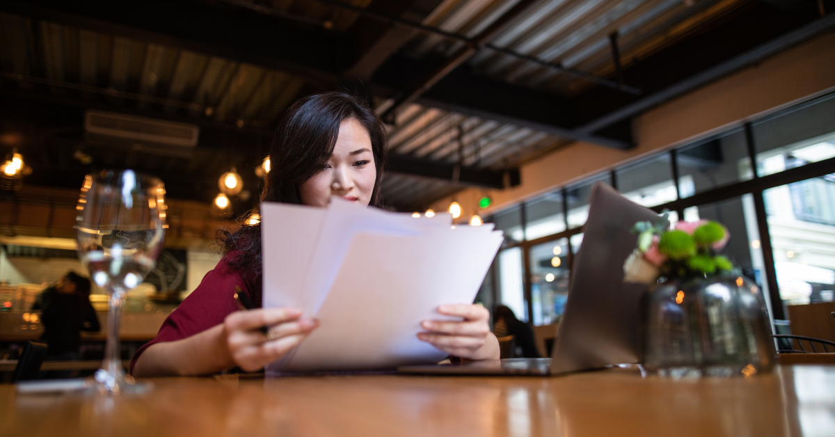 Woman reviewing tax documents for the child tax credit refund date 2025.