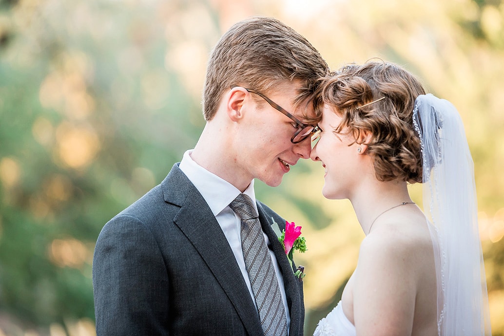 A couple enjoying their wedding day with an affordable wedding photographer and videographer capturing the moment.