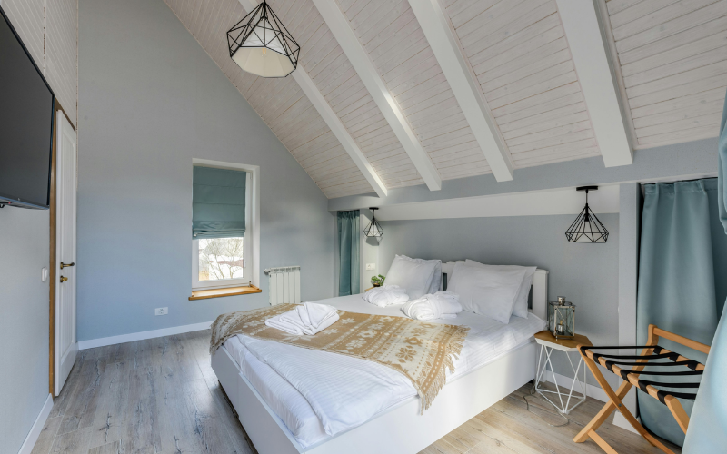 A vaulted ceiling room with modern paintjob