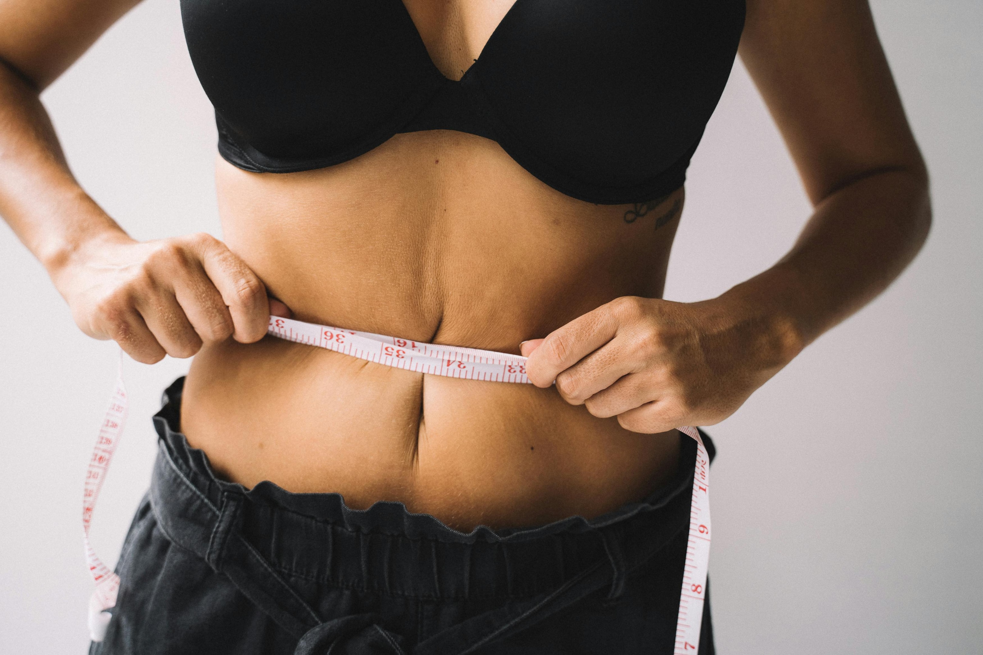 Photo by Anna Tarazevich: https://www.pexels.com/photo/woman-s-hands-measuring-her-waistline-5629206/