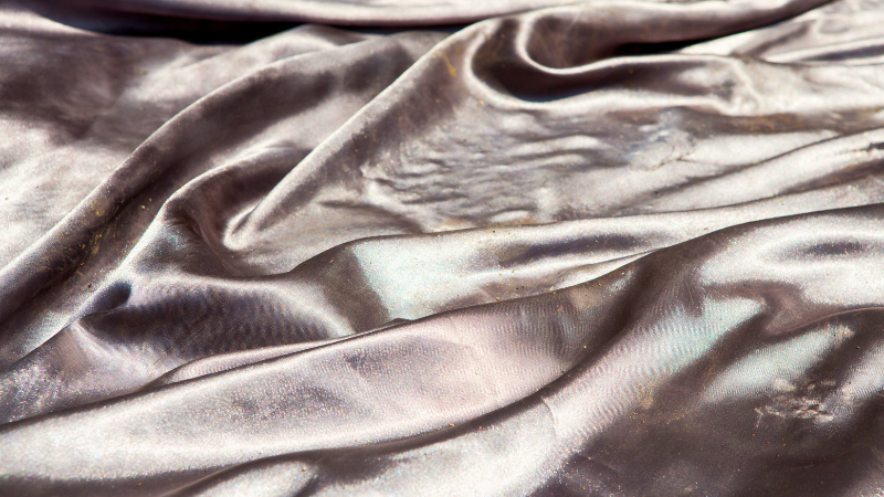 A close up shot of a silver nylon fabric