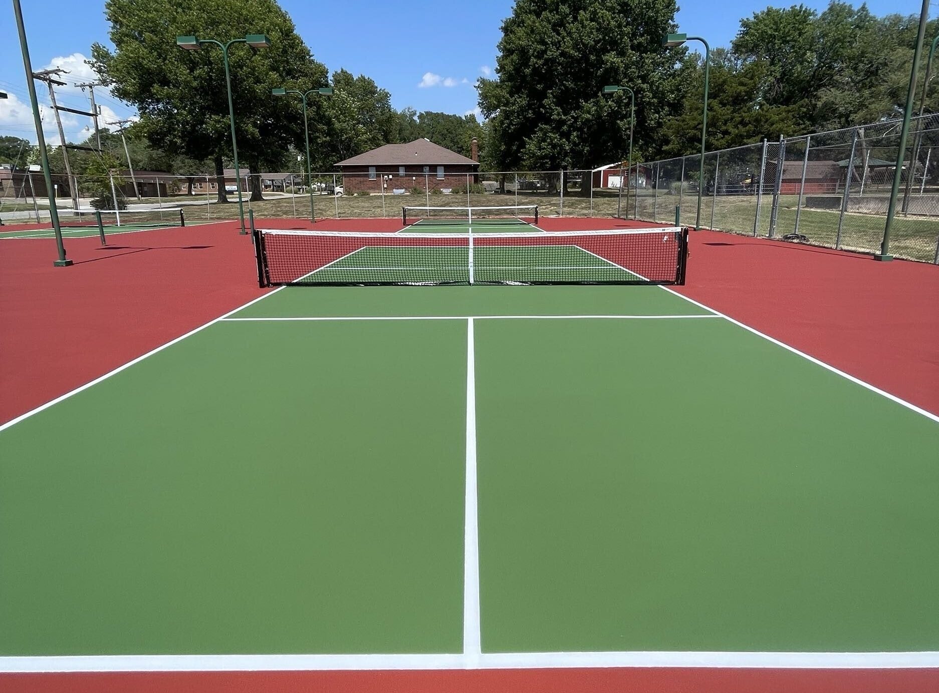 Beautiful and fresh pickleball court with bright, clean surfacing and crisp white lines