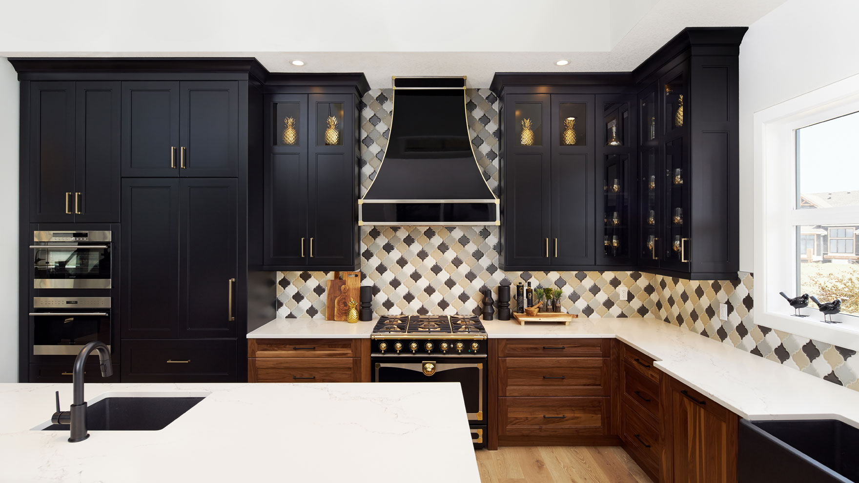 art deco kitchen with black cabinets and gold hardware