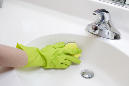 Scrub the sink with a cloth or sponge