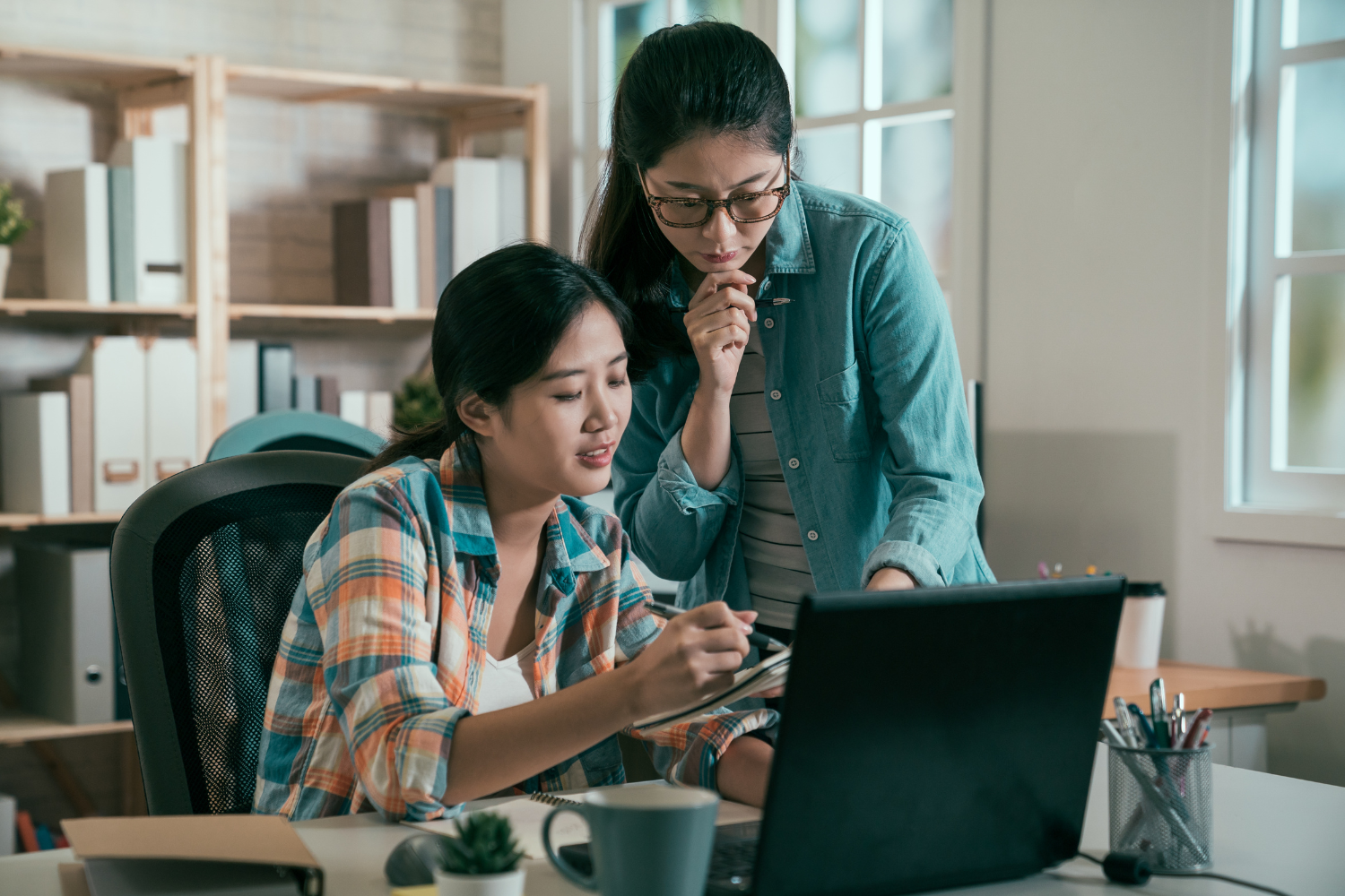 Two coworkers helping each other out.