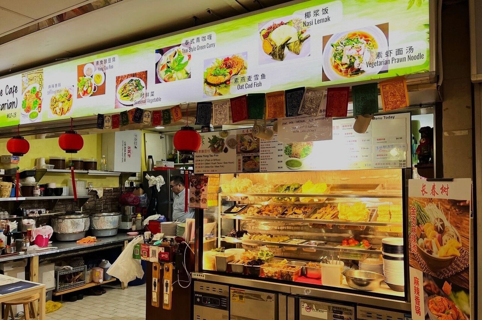 The interior of Pine Tree Cafe in Singapore featuring an extensive buffet of colorful and appetizing food selections.