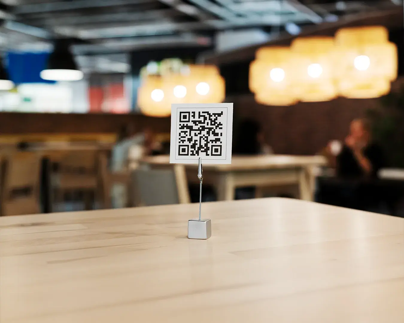 QR code menu displayed on a restaurant table, supporting contactless ordering, digital menus, and modern restaurant operations.