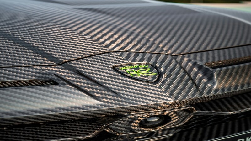 Close-up of 5D carbon fiber wrap finish on car hood