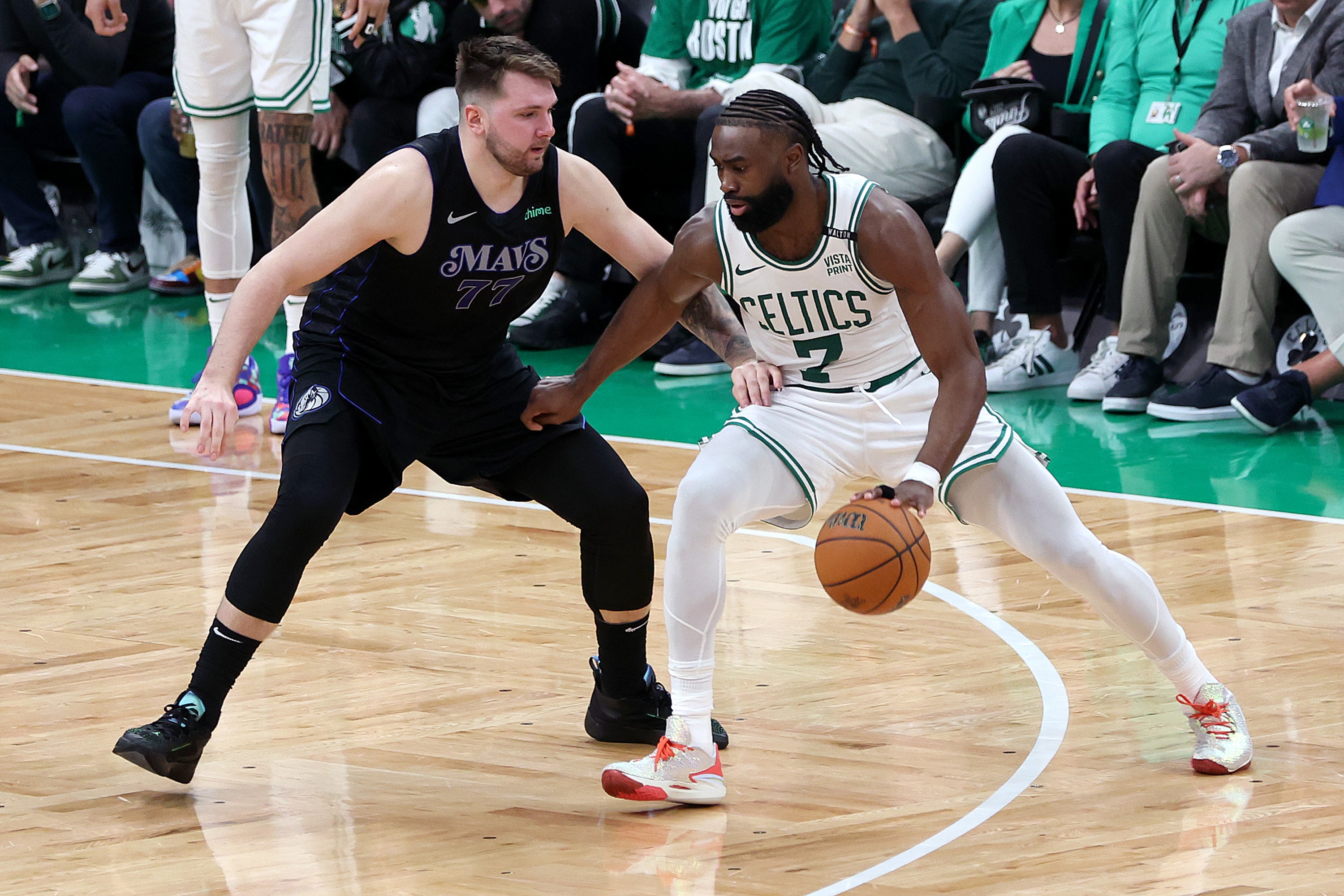 NBA Playoff MVP Jaylen Brown of the Boston Celtics drives to the basket against Luka Doncic of the Dallas Mavericks during.