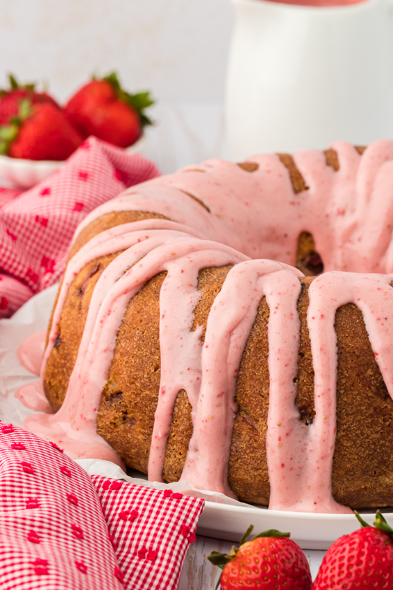 strawberry pound cake with glaze on a plate