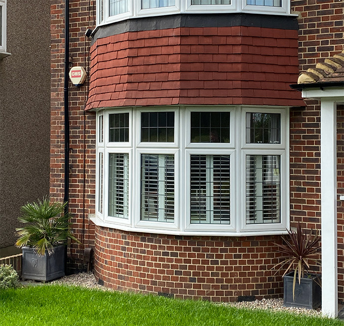 plantation shutters in bay window from the outside