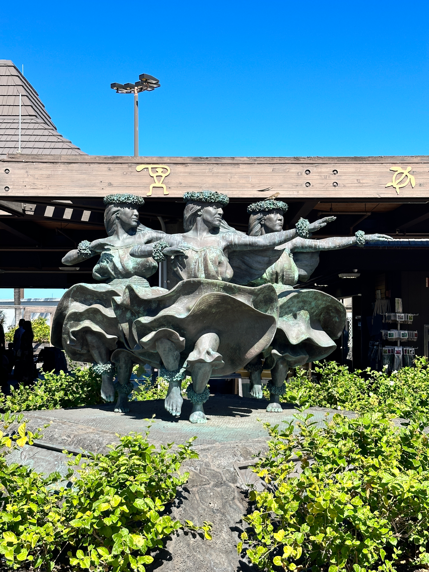 Hula Kahiko sculpture at Kona International Airport