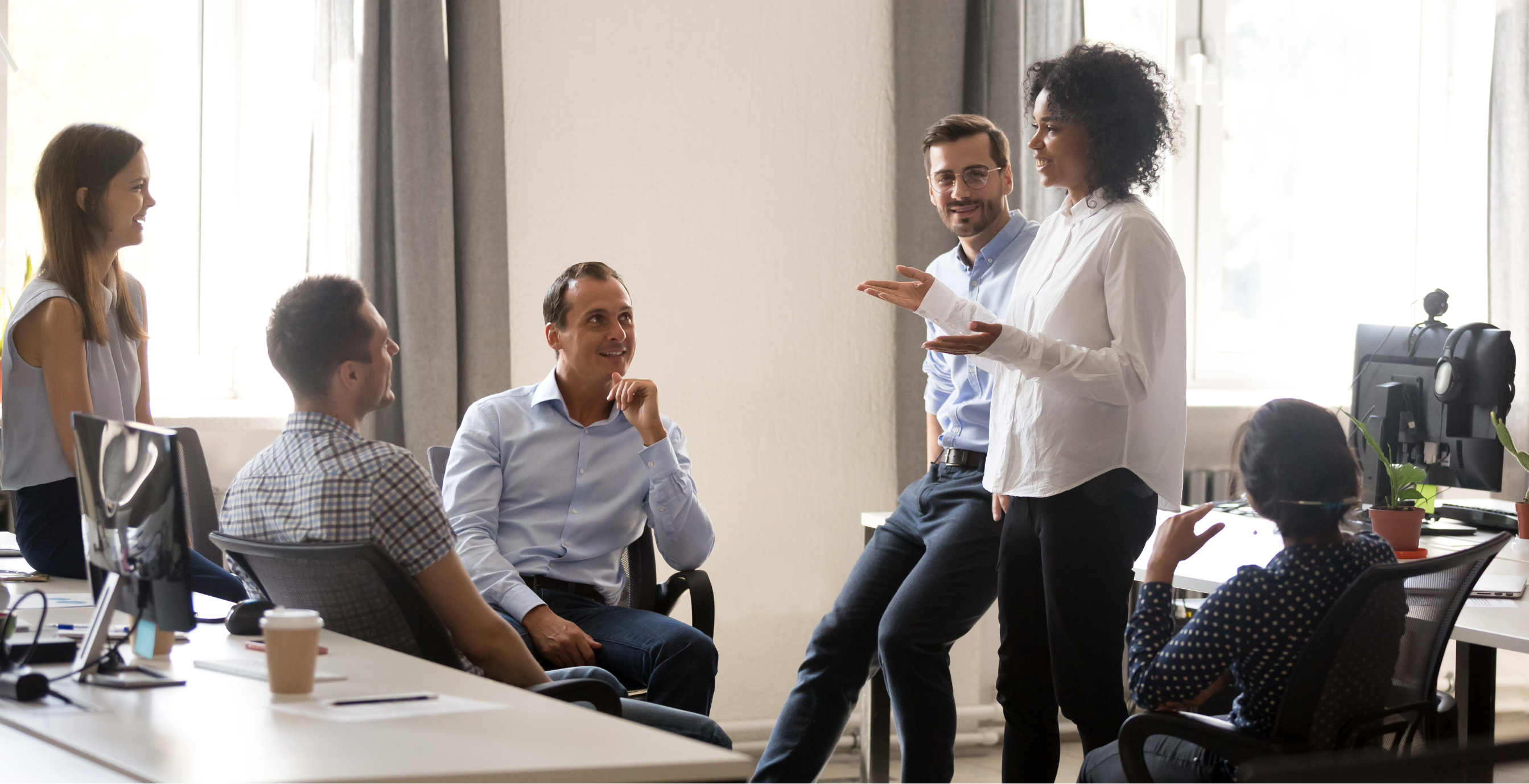 An image showing a person confidently leading a team, representing the transitioning to leadership roles discussed in the article about Understanding the Difference Between Management and Leadership.