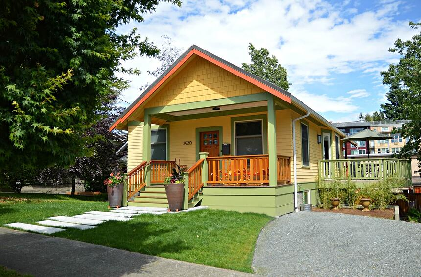 Updated front porch in bright yellow and green.