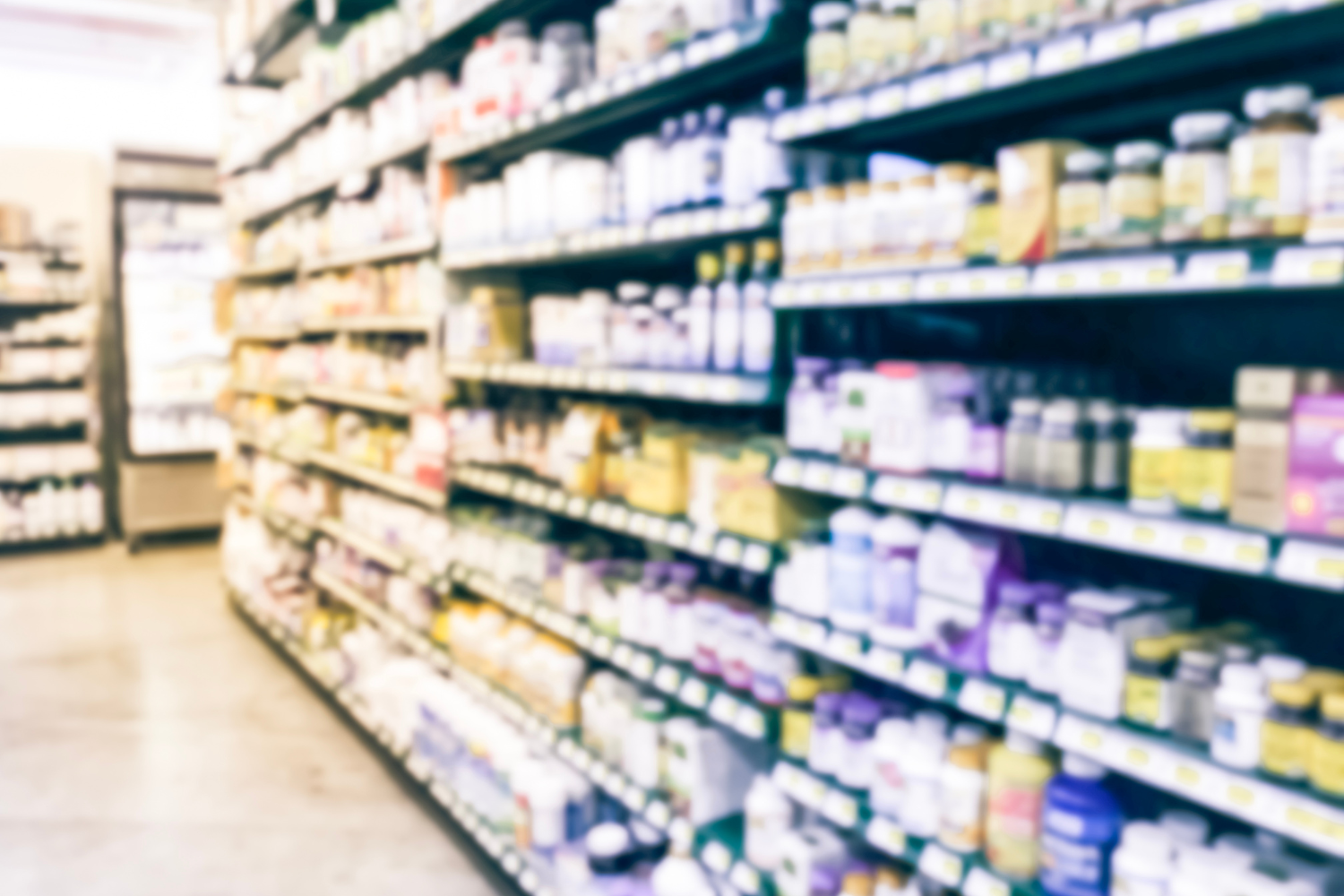 Rows of supplements in a retail store.
