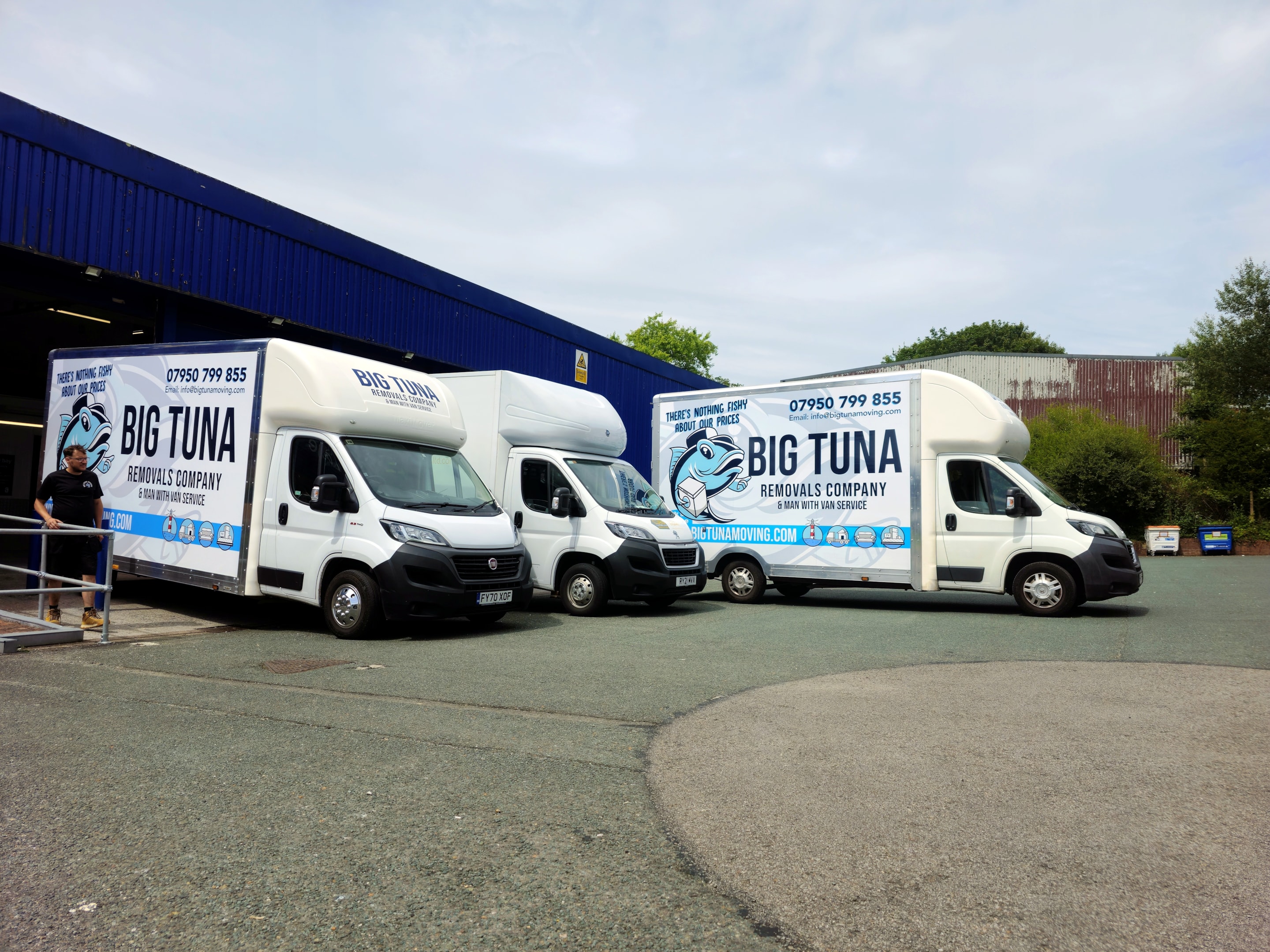 A picture depicting why Friday is a popular day to move house. showing lots of removals vans in Plymouth all lined up