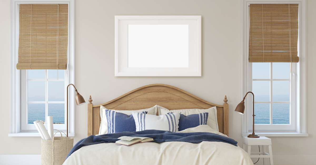 Cozy bedroom with nautical decor and ocean views from two windows in a North Wildwood vacation rental.