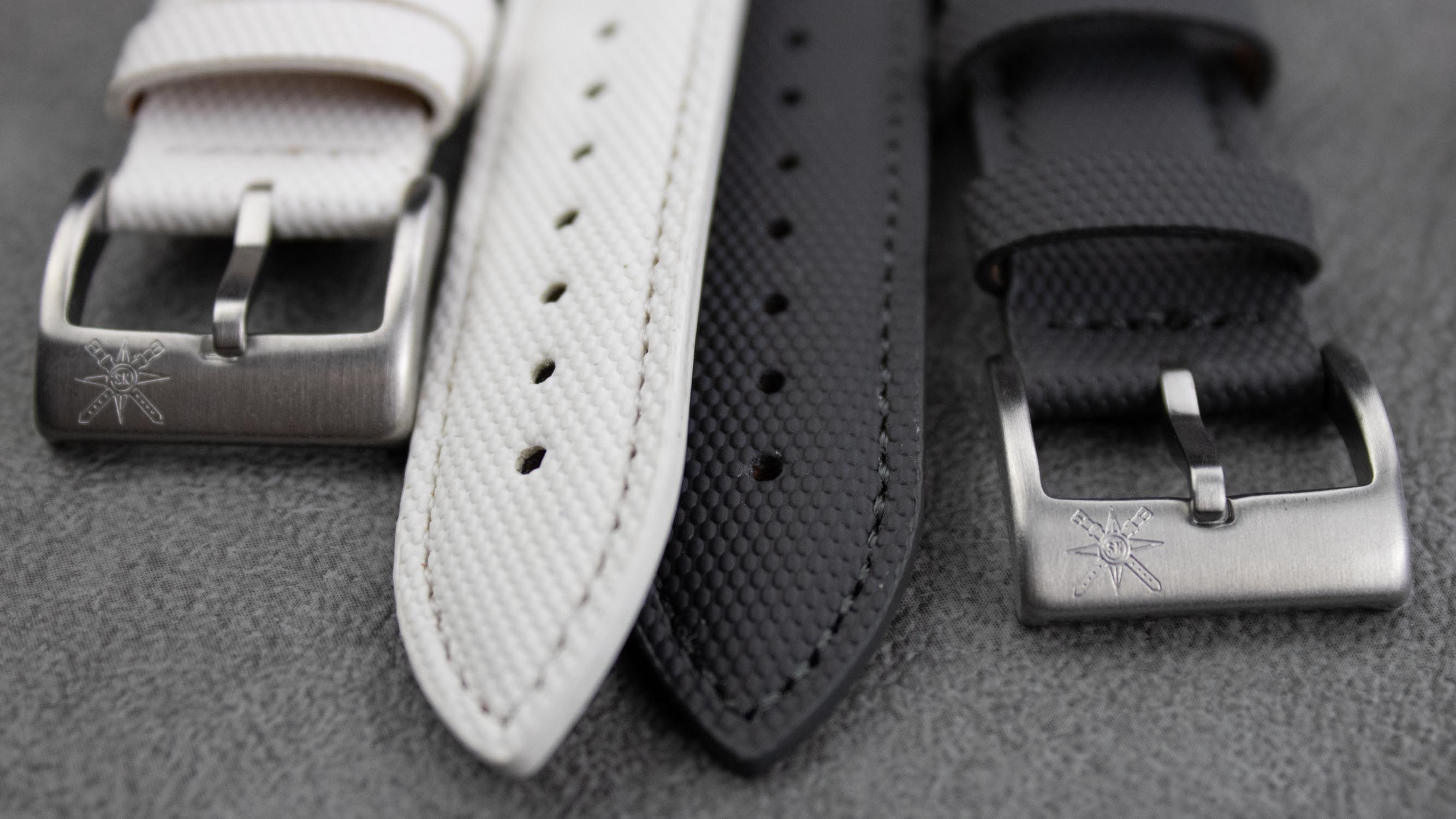 Different watch models paired with stylish sailcloth watch straps.