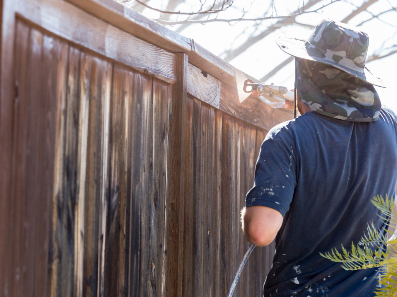 An image showing a professional fence contractor installing a high-quality fence in Phoenix.