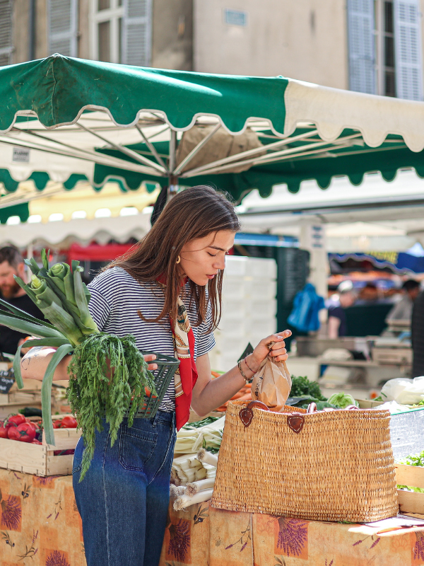 picking vegetables at a Houston farmers market