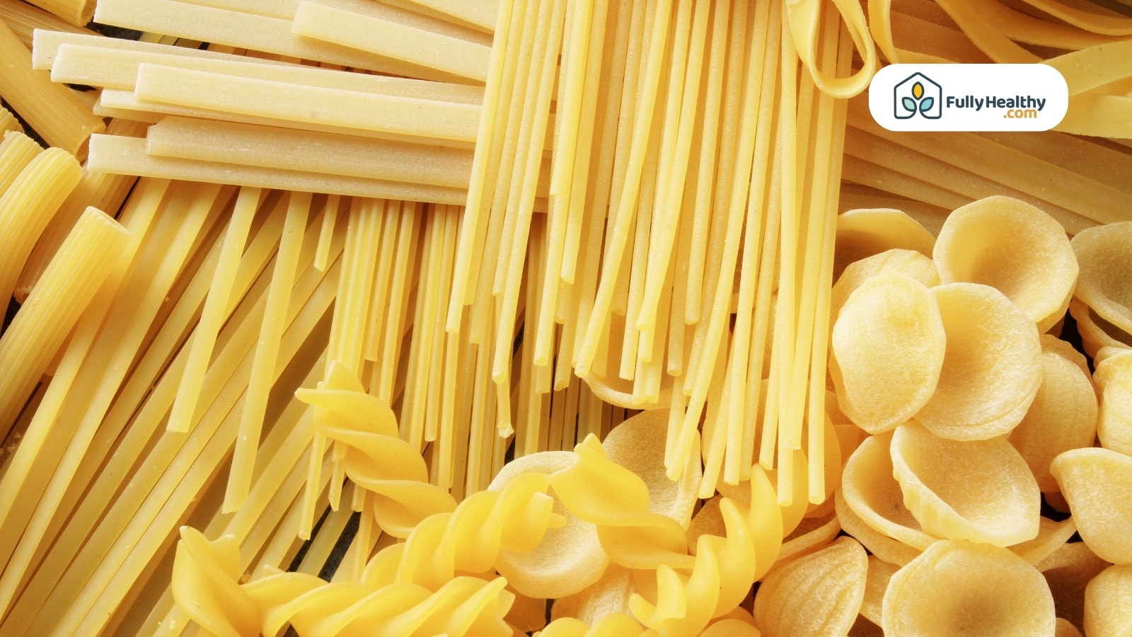 Assorted dry pasta shapes including linguine, fusilli, and orecchiette