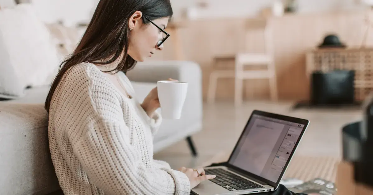 Woman reviewing OnlyFans income and expenses to understand tax loopholes.