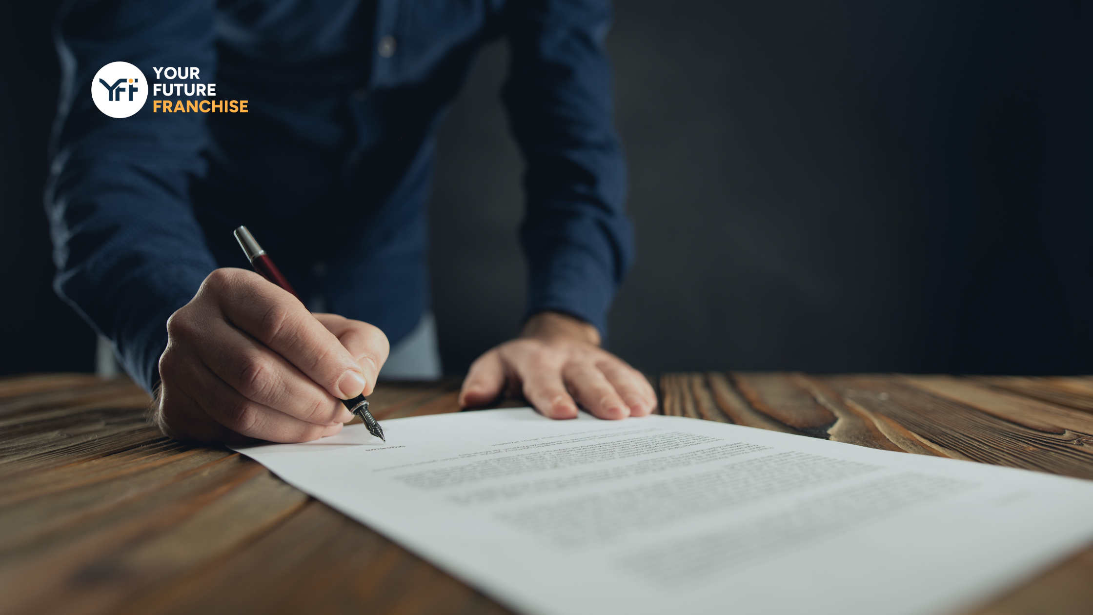 Businessman signing a document 