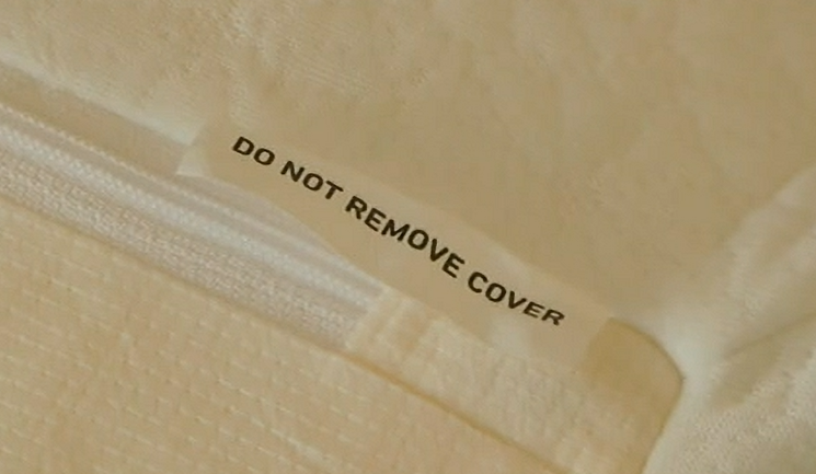 Do not remove cover tag on a Zinus mattress