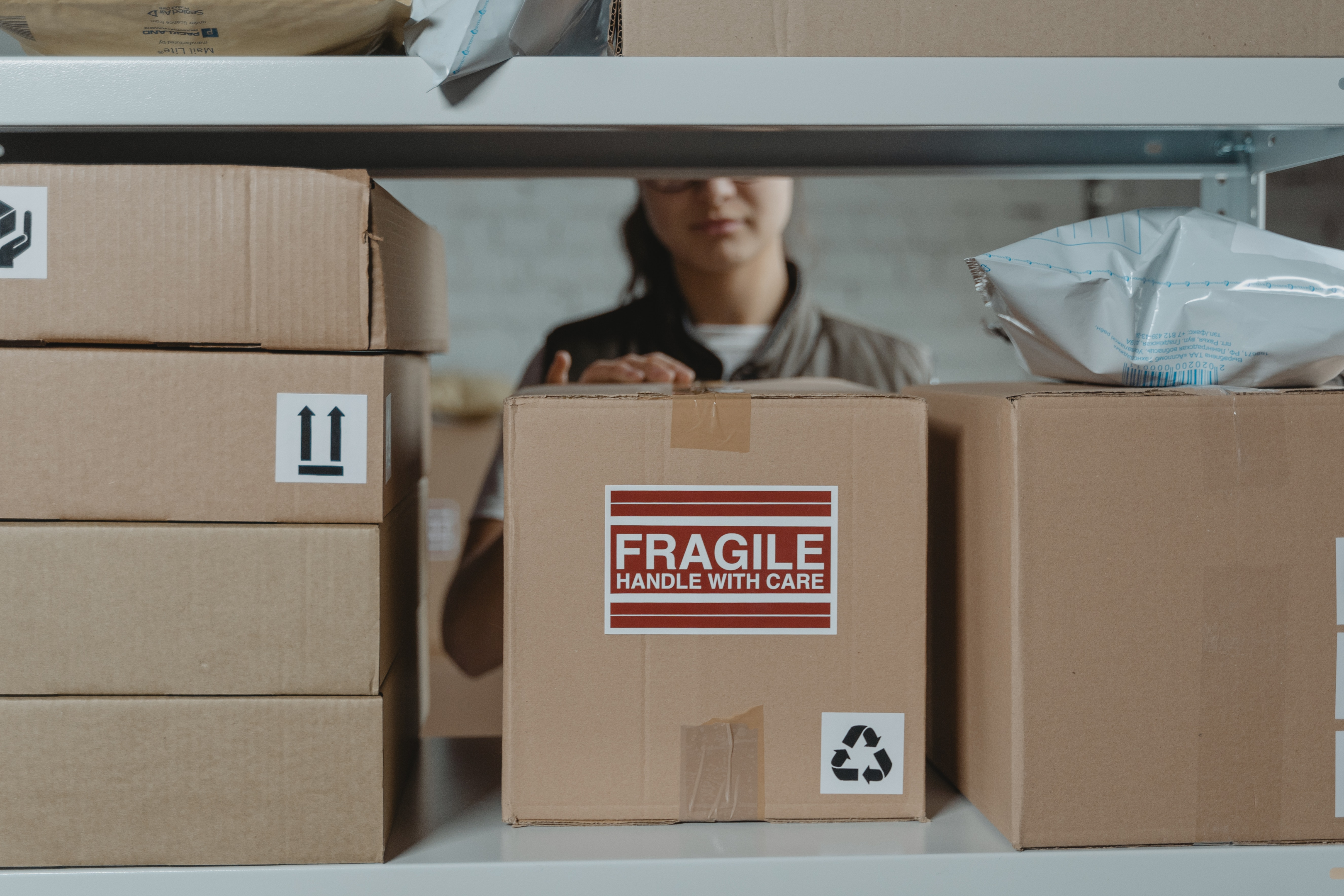 A fragile package being prepared for shipping