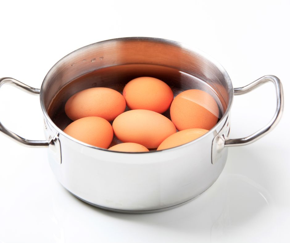 saucepan with water and eggs in it