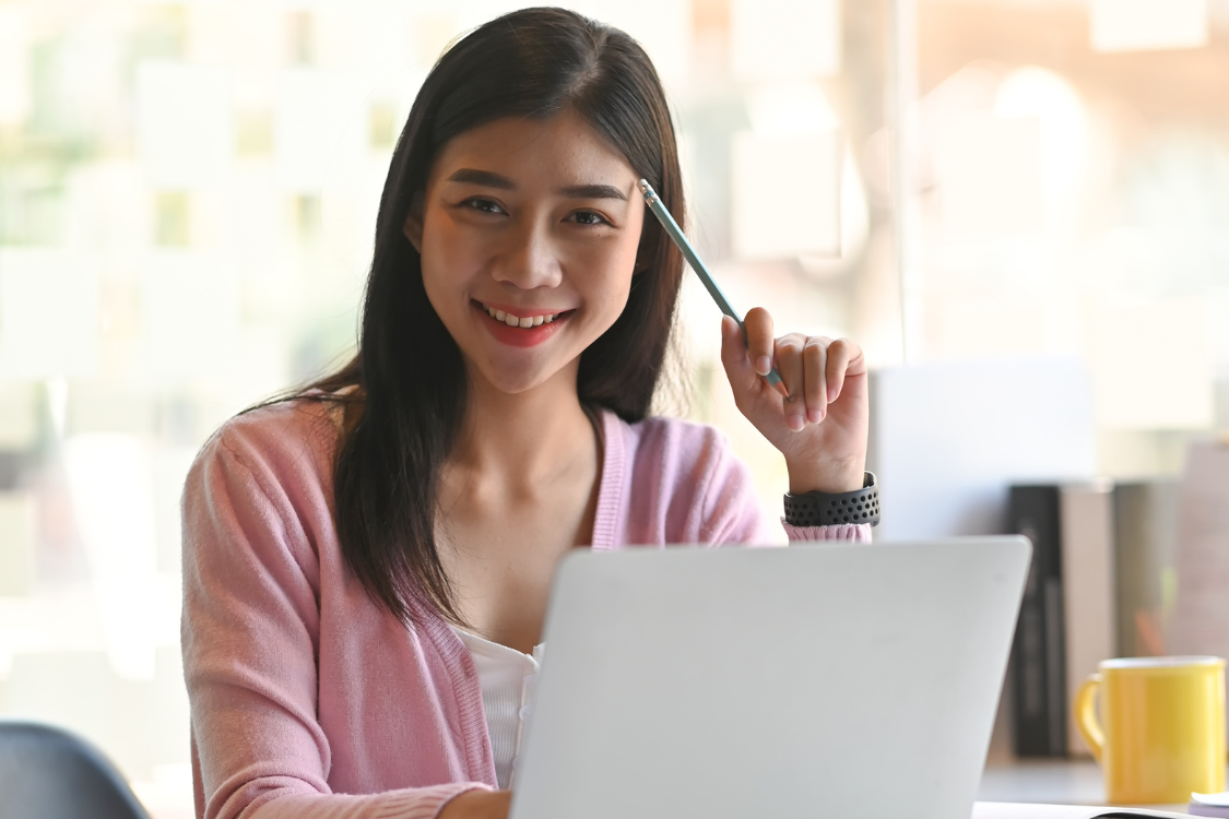 Confident Filipino job applicant smiling while preparing for an online job interview
